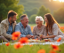 Famille multigenerations profitant d'un pique-nique dans un champ de coquelicots